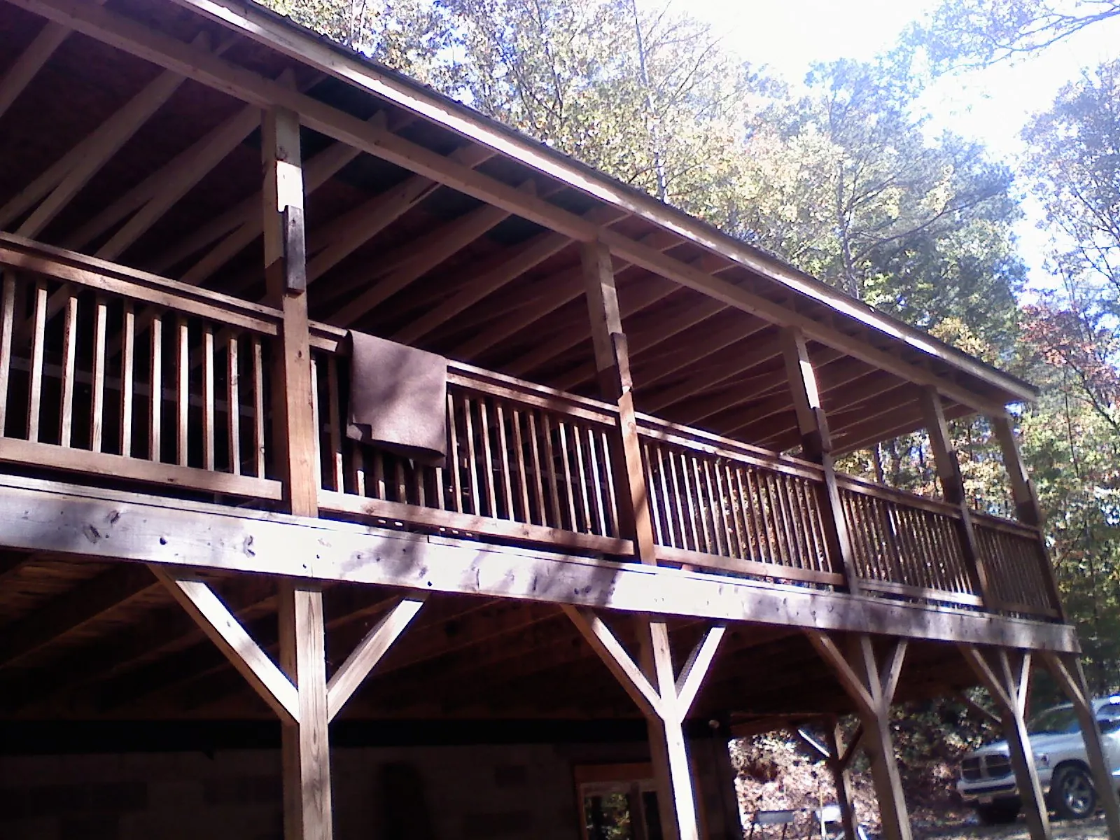 Timber framing under a new elevated porch and deck — Roof Leak Repair in West Henrietta by Roofing Brothers
